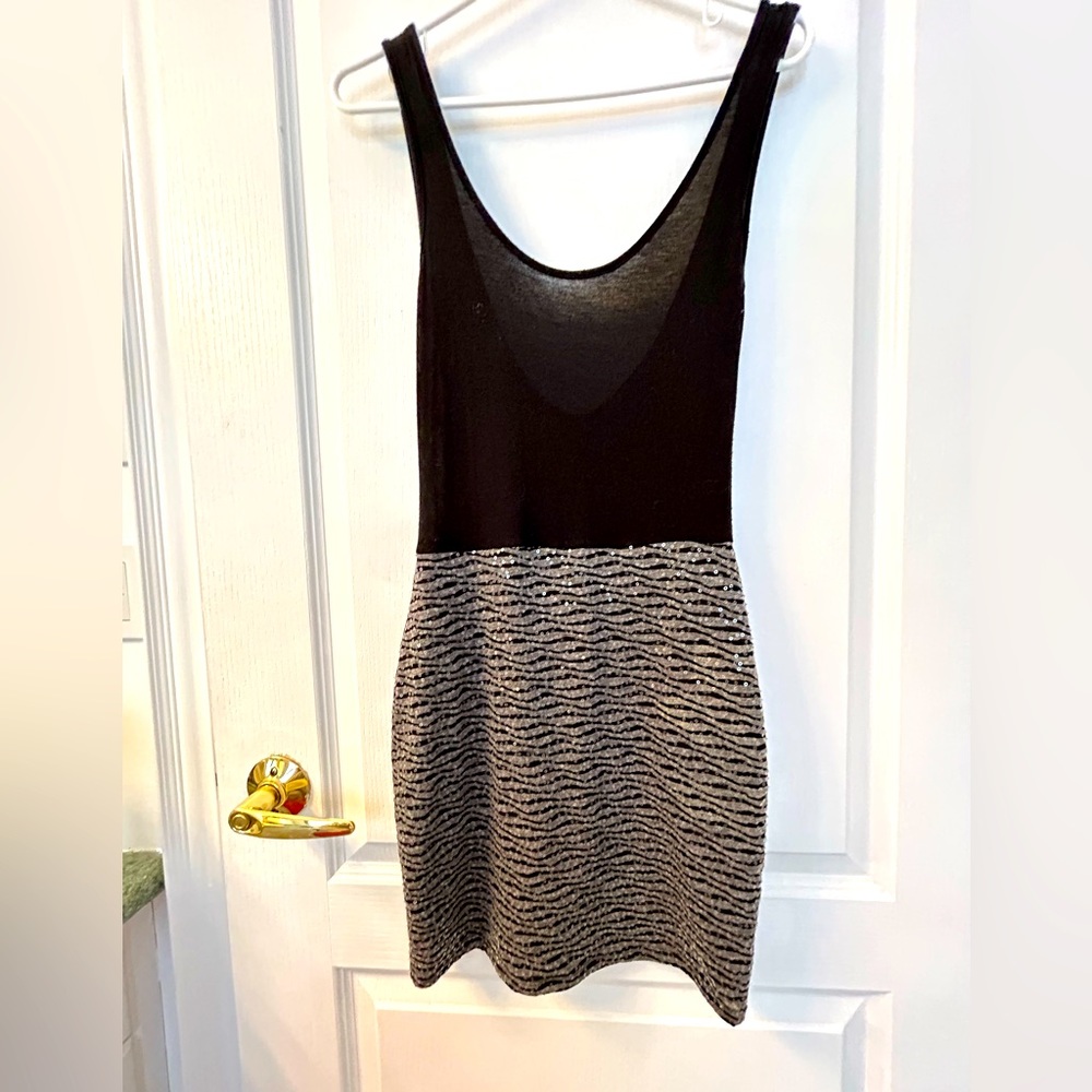 Women’s small Potters Pot party dress in black knit and sequins. Form fitting.